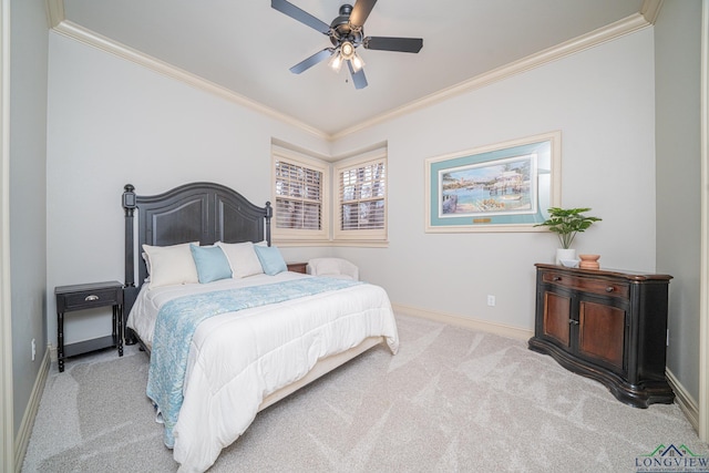 carpeted bedroom featuring crown molding and ceiling fan