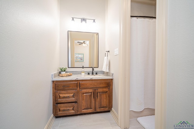 bathroom featuring tile patterned flooring and vanity