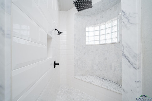 bathroom featuring tiled shower