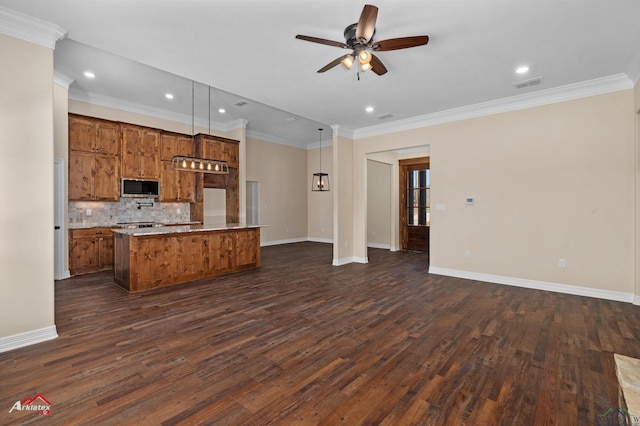 kitchen featuring dark wood-style floors, visible vents, stainless steel microwave, tasteful backsplash, and open floor plan