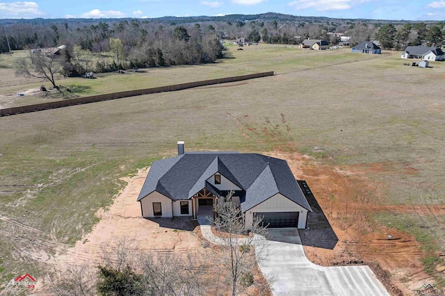 birds eye view of property featuring a rural view