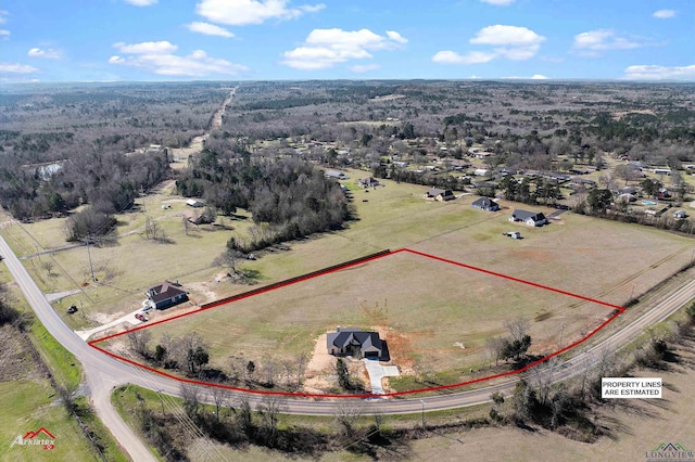 birds eye view of property with a rural view