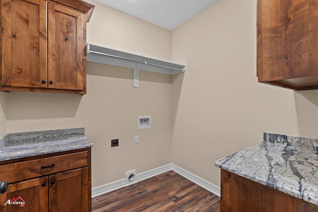 laundry area featuring hookup for a washing machine, baseboards, hookup for an electric dryer, cabinet space, and dark wood-style flooring