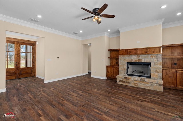 unfurnished living room featuring visible vents, baseboards, dark wood finished floors, and crown molding