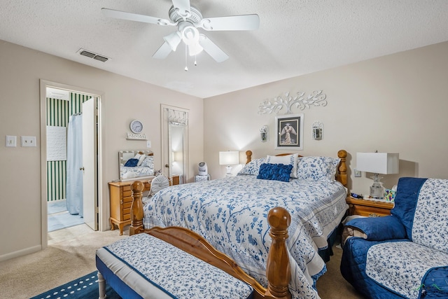 carpeted bedroom with a textured ceiling and ceiling fan