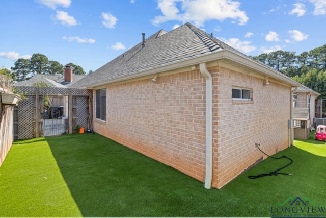 view of home's exterior featuring a yard