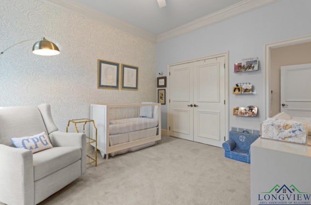 sitting room with light colored carpet and ornamental molding