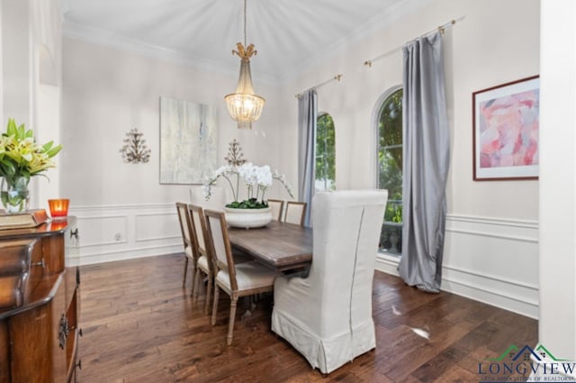 dining room with ornamental molding, dark wood-type flooring, and a notable chandelier