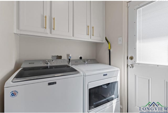 laundry room featuring cabinets and independent washer and dryer