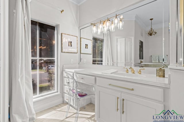 bathroom featuring tile patterned flooring, vanity, and ornamental molding