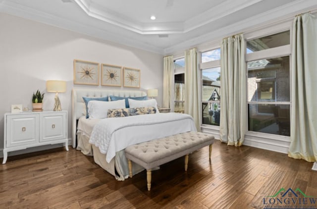 bedroom featuring a tray ceiling, crown molding, and dark hardwood / wood-style floors