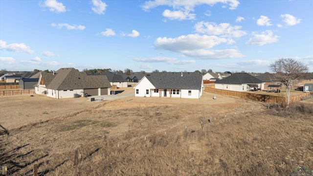 view of yard featuring a residential view and fence