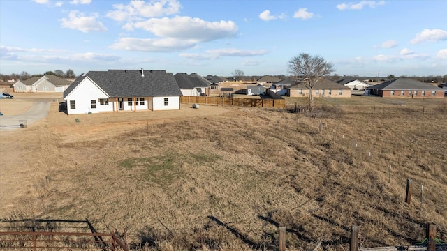 view of yard with a residential view and fence