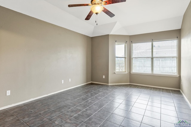 207 Willow Rd, Bullard, TX 75757 - empty room featuring baseboards, dark tile patterned flooring, vaulted ceiling, and a ceiling fan