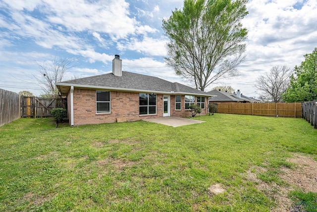 207 Willow Rd, Bullard, TX 75757 - back of house featuring a patio, brick siding, a fenced backyard, and a lawn