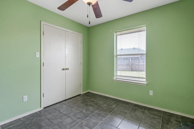 207 Willow Rd, Bullard, TX 75757 - unfurnished bedroom featuring tile patterned flooring, a ceiling fan, baseboards, and a closet