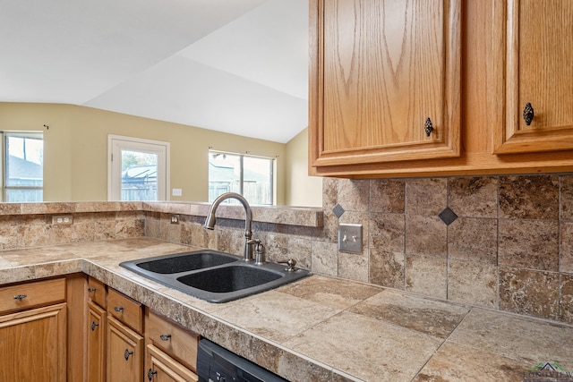207 Willow Rd, Bullard, TX 75757 - kitchen featuring backsplash, a sink, tile counters, and lofted ceiling