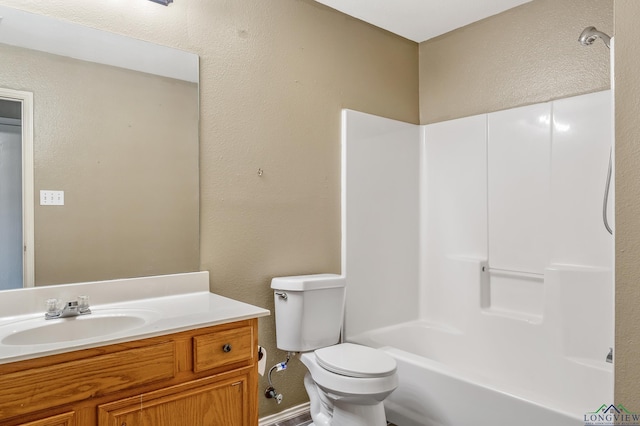 207 Willow Rd, Bullard, TX 75757 - bathroom with a textured wall,  shower combination, toilet, and vanity
