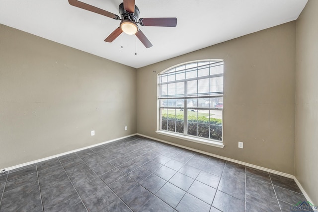207 Willow Rd, Bullard, TX 75757 - unfurnished room with baseboards, a ceiling fan, and dark tile patterned floors