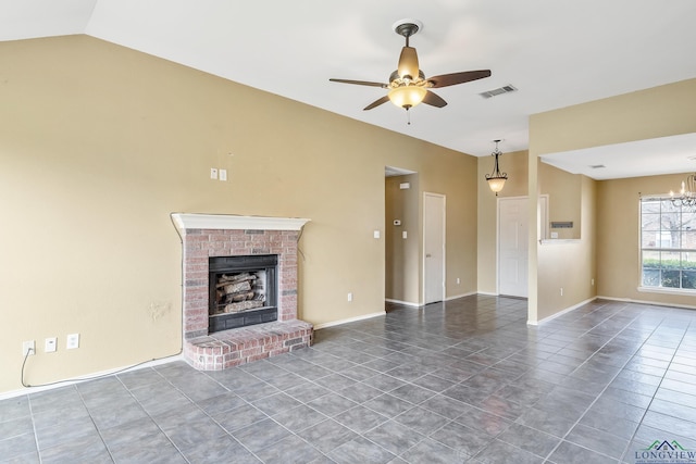 207 Willow Rd, Bullard, TX 75757 - unfurnished living room with tile patterned flooring, lofted ceiling, ceiling fan with notable chandelier, visible vents, and a fireplace