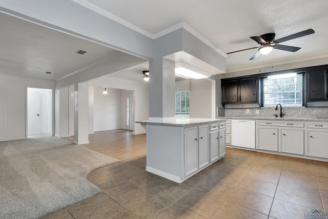 3897 Lansing Switch Rd, Longview, TX 75602 - kitchen with open floor plan, crown molding, ceiling fan, dishwasher, and light tile patterned flooring
