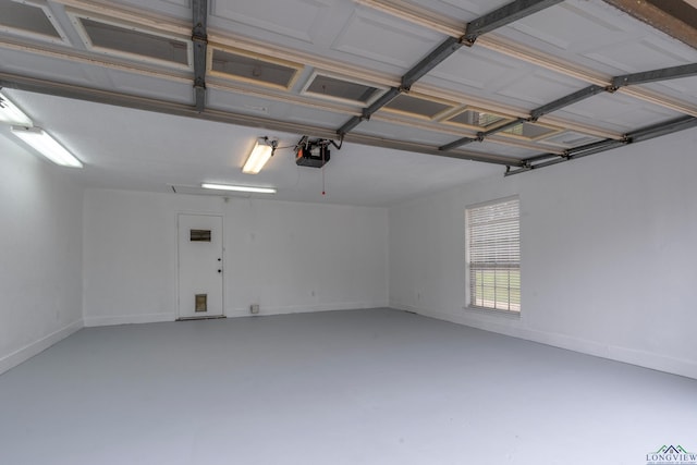 3897 Lansing Switch Rd, Longview, TX 75602 - garage featuring baseboards and a garage door opener