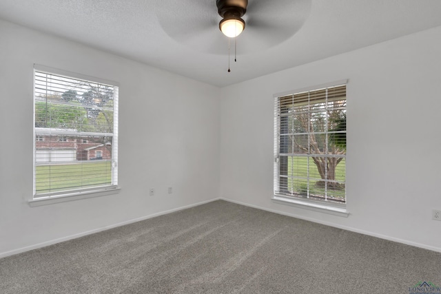 3897 Lansing Switch Rd, Longview, TX 75602 - unfurnished room with a ceiling fan, a wealth of natural light, baseboards, and carpet floors