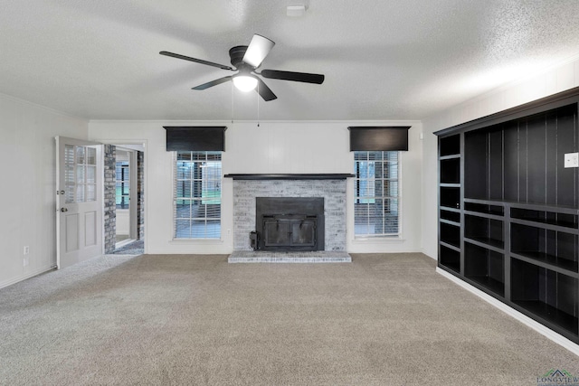 3897 Lansing Switch Rd, Longview, TX 75602 - unfurnished living room featuring ceiling fan, a textured ceiling, carpet floors, and plenty of natural light