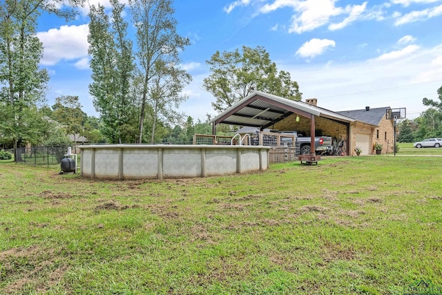 view of yard with a carport