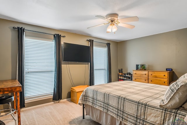 bedroom with light colored carpet and ceiling fan