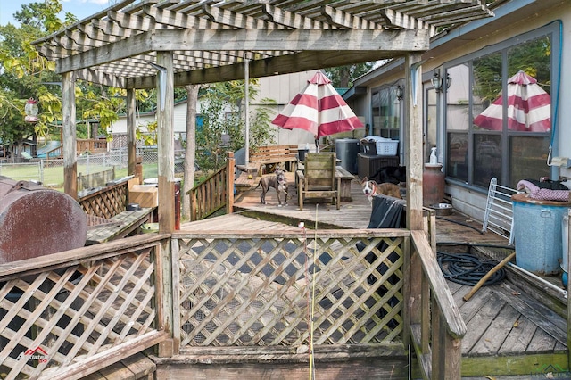 view of patio featuring a pergola and a deck