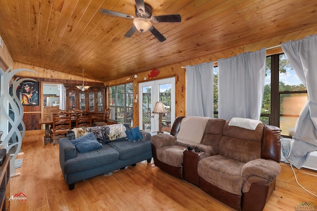 living room featuring ceiling fan, wooden ceiling, wood walls, vaulted ceiling, and light wood-type flooring