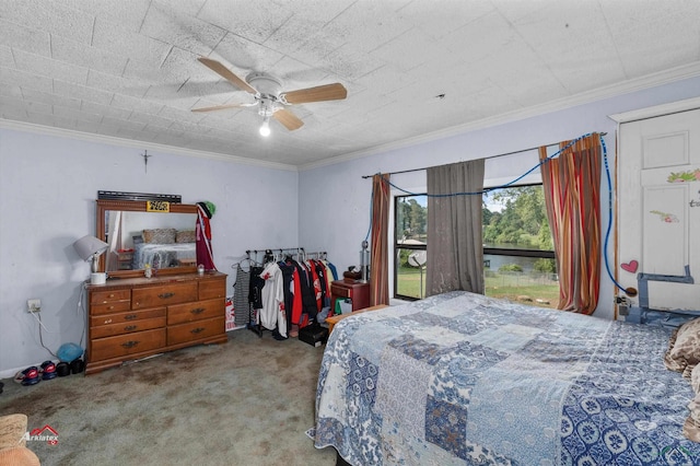 carpeted bedroom featuring ceiling fan and ornamental molding