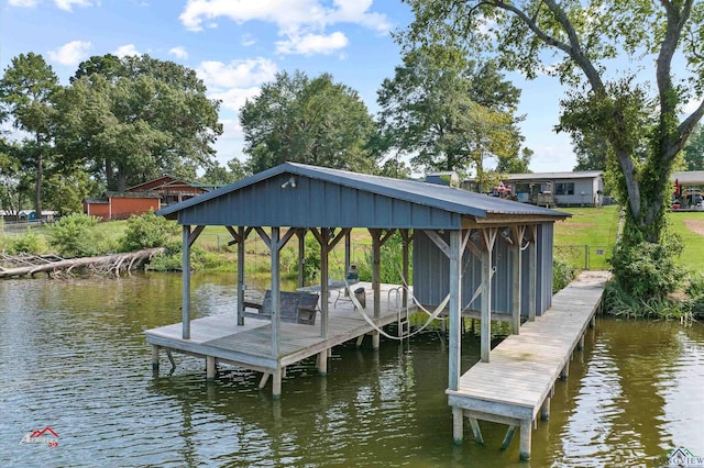 dock area with a water view