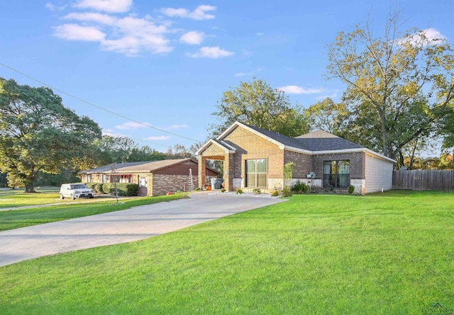 ranch-style house with a front lawn