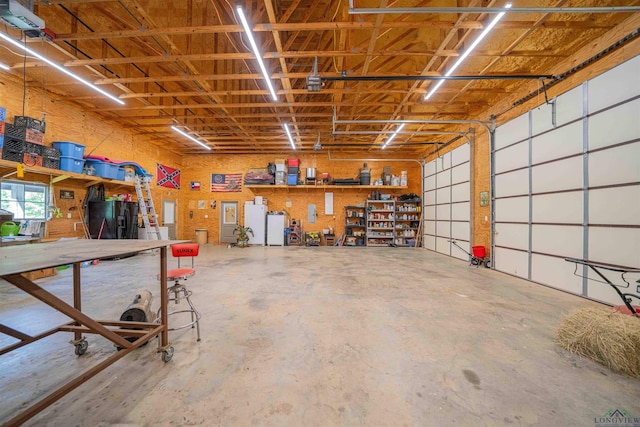 4754 Deer Rd, Gilmer, TX 75644 - garage with black fridge