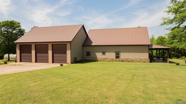 4754 Deer Rd, Gilmer, TX 75644 - view of side of property featuring a garage, a yard, dirt driveway, and metal roof
