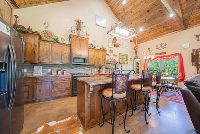 4754 Deer Rd, Gilmer, TX 75644 - kitchen featuring wood ceiling, concrete floors, appliances with stainless steel finishes, and high vaulted ceiling