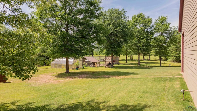 4754 Deer Rd, Gilmer, TX 75644 - view of yard featuring an exterior structure and an outdoor structure