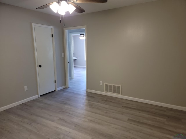 711 Wildwood Rd, Daingerfield, TX 75638 - spare room featuring a ceiling fan and wood finished floors