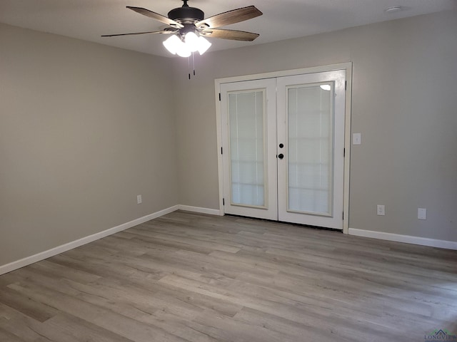 711 Wildwood Rd, Daingerfield, TX 75638 - unfurnished room with french doors, ceiling fan, and wood finished floors