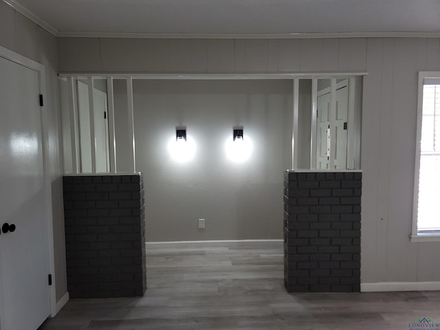 711 Wildwood Rd, Daingerfield, TX 75638 - empty room featuring ornamental molding and wood finished floors