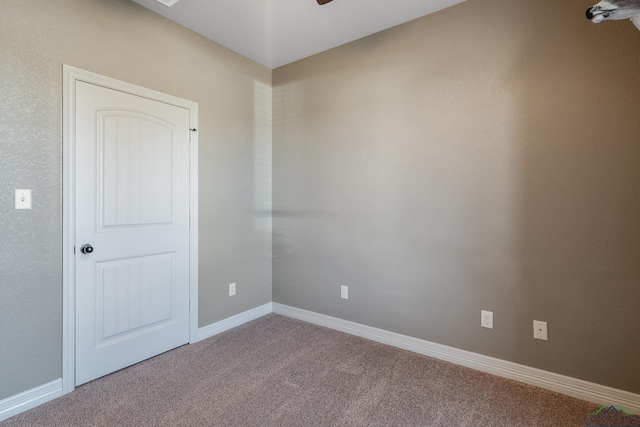 unfurnished room featuring carpet