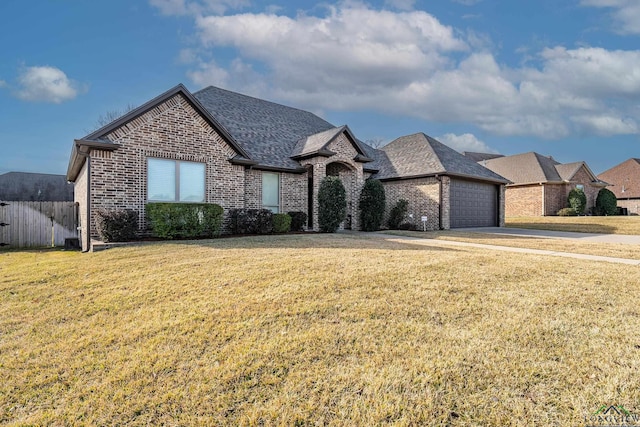 view of front facade featuring a garage and a front yard