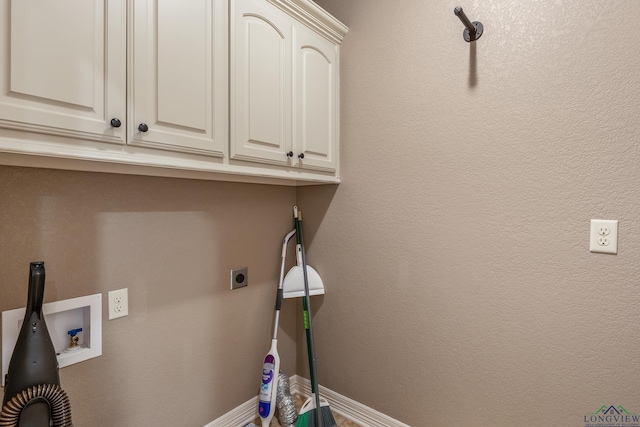 washroom featuring cabinets, hookup for a washing machine, and hookup for an electric dryer