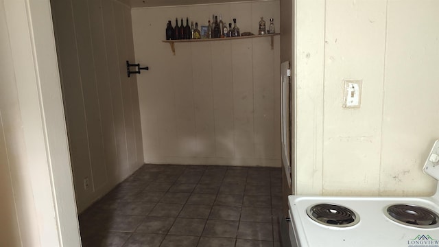 interior space featuring wood walls and washer / clothes dryer