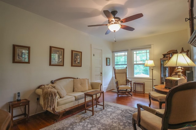 sitting room featuring ceiling fan and wood finished floors