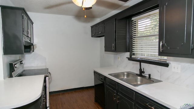 kitchen with stove, dark hardwood / wood-style flooring, backsplash, a textured ceiling, and dishwasher