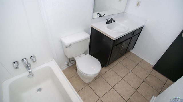 bathroom with tile patterned flooring, a bath, vanity, and toilet