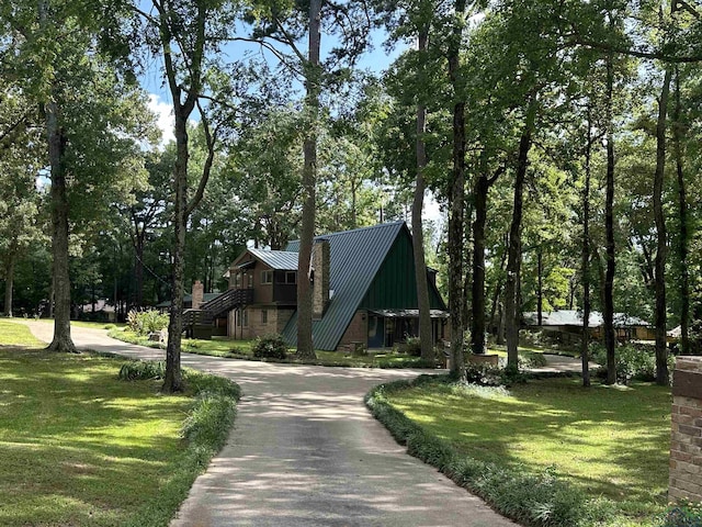 view of home's community with a lawn